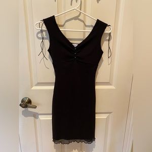 Black body con dress with rhinestone detail and lettuce hem